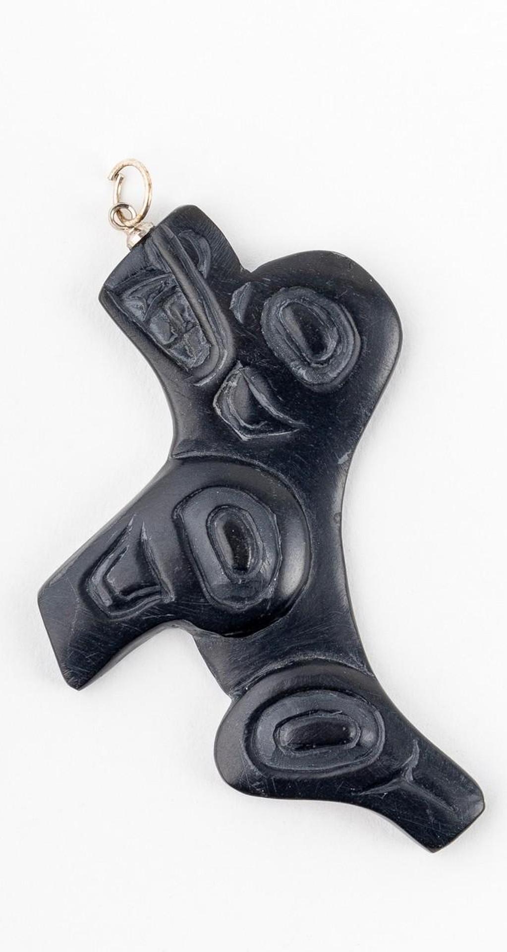 Greg White - a carved argillite pendant depicting Seal