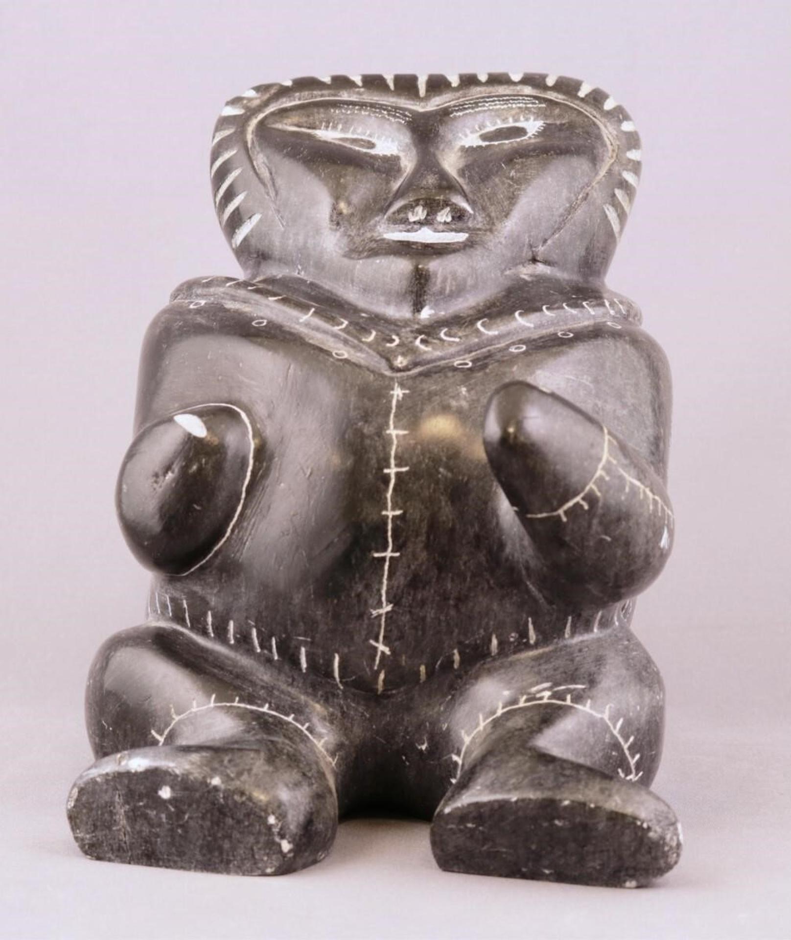 William Kawakit - a grey-black stone carving of a Seated Figure, initialed and inscribed with region