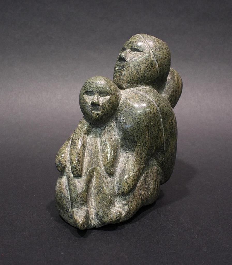 Kopapik - a green serpentine carving of a mother and children