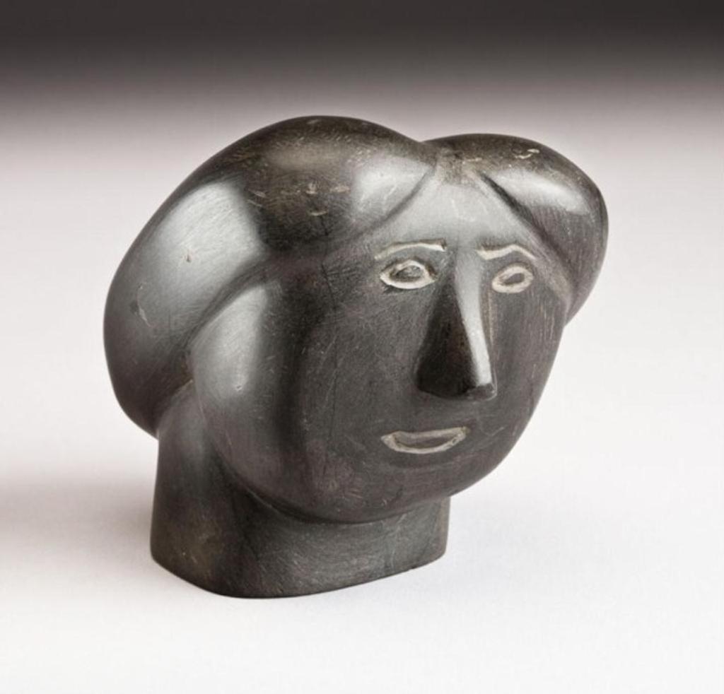 John Killulark (1935) - Head of a woman, black stone