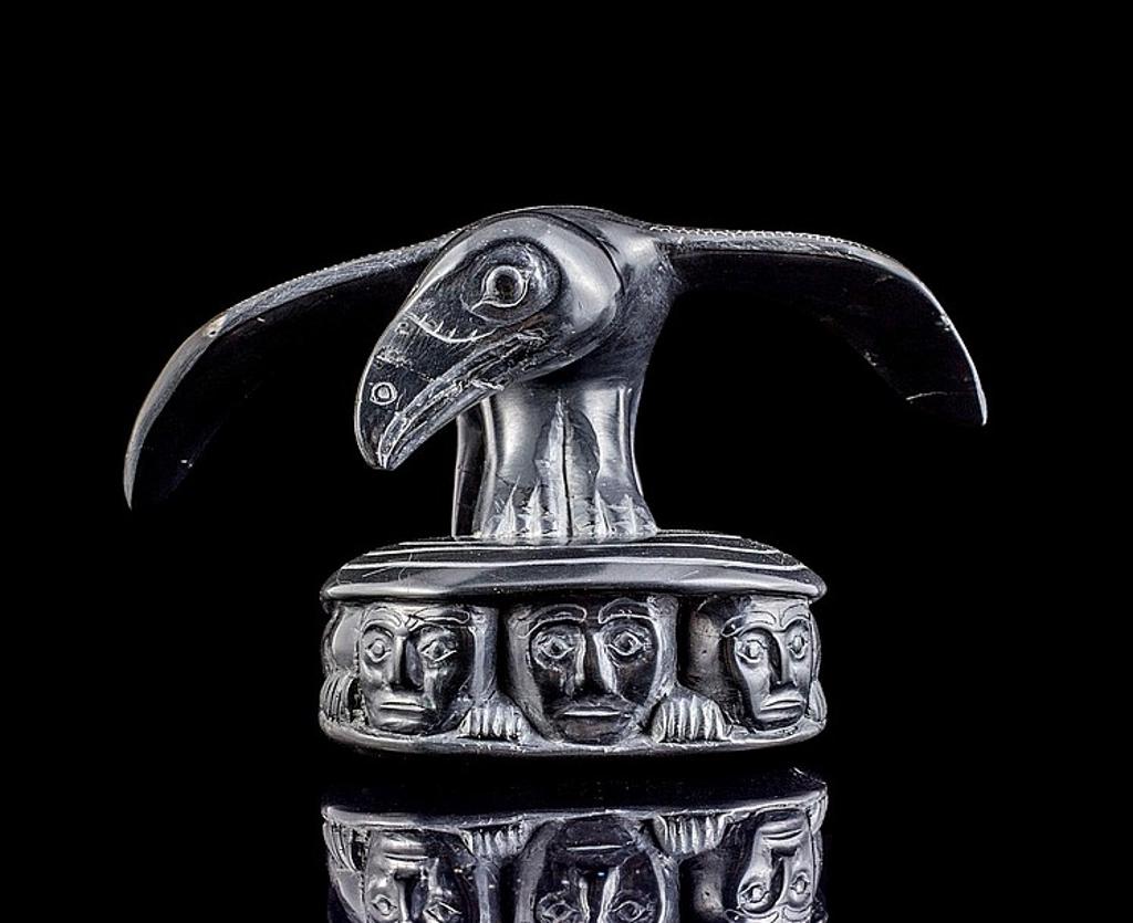 Claude Davidson (1924-1991) - an argillite carving depicting Raven and the First Men