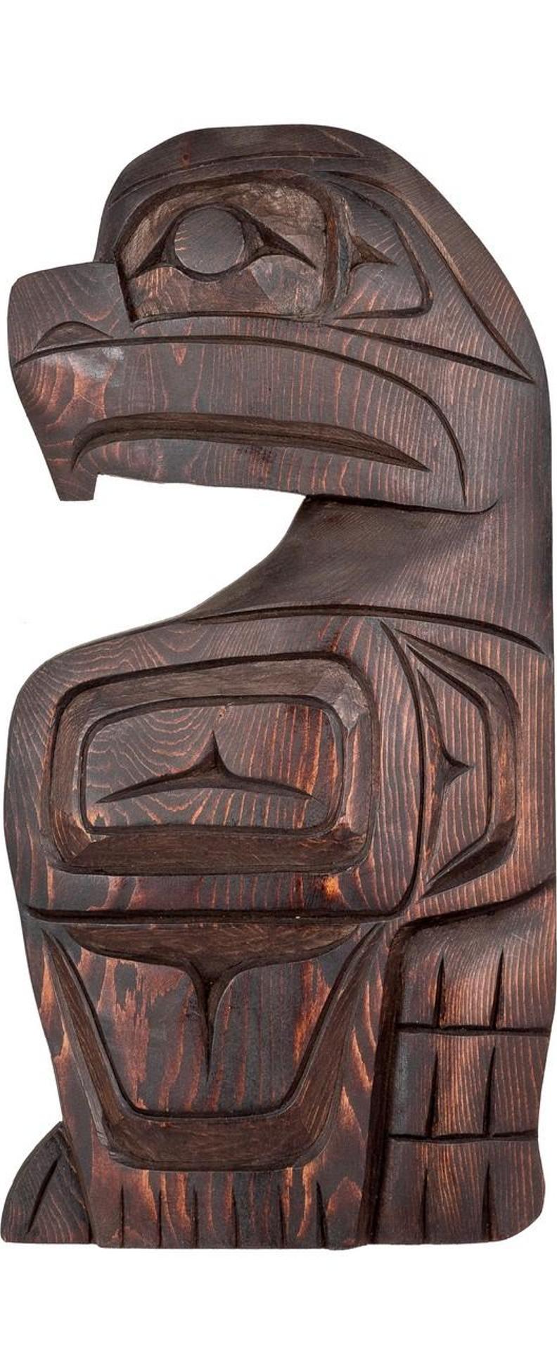 Roger Johnnie - a carved and stained cedar panel depicting Eagle
