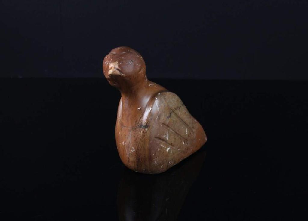 Bruce Cox - a brown stone carving of a bird