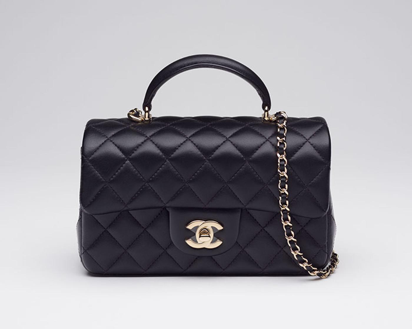 Chanel - A BLACK LAMBSKIN RECTANGULAR MINI TOP HANDLE FLAP BAG WITH LIGHT GOLD HARDWARE