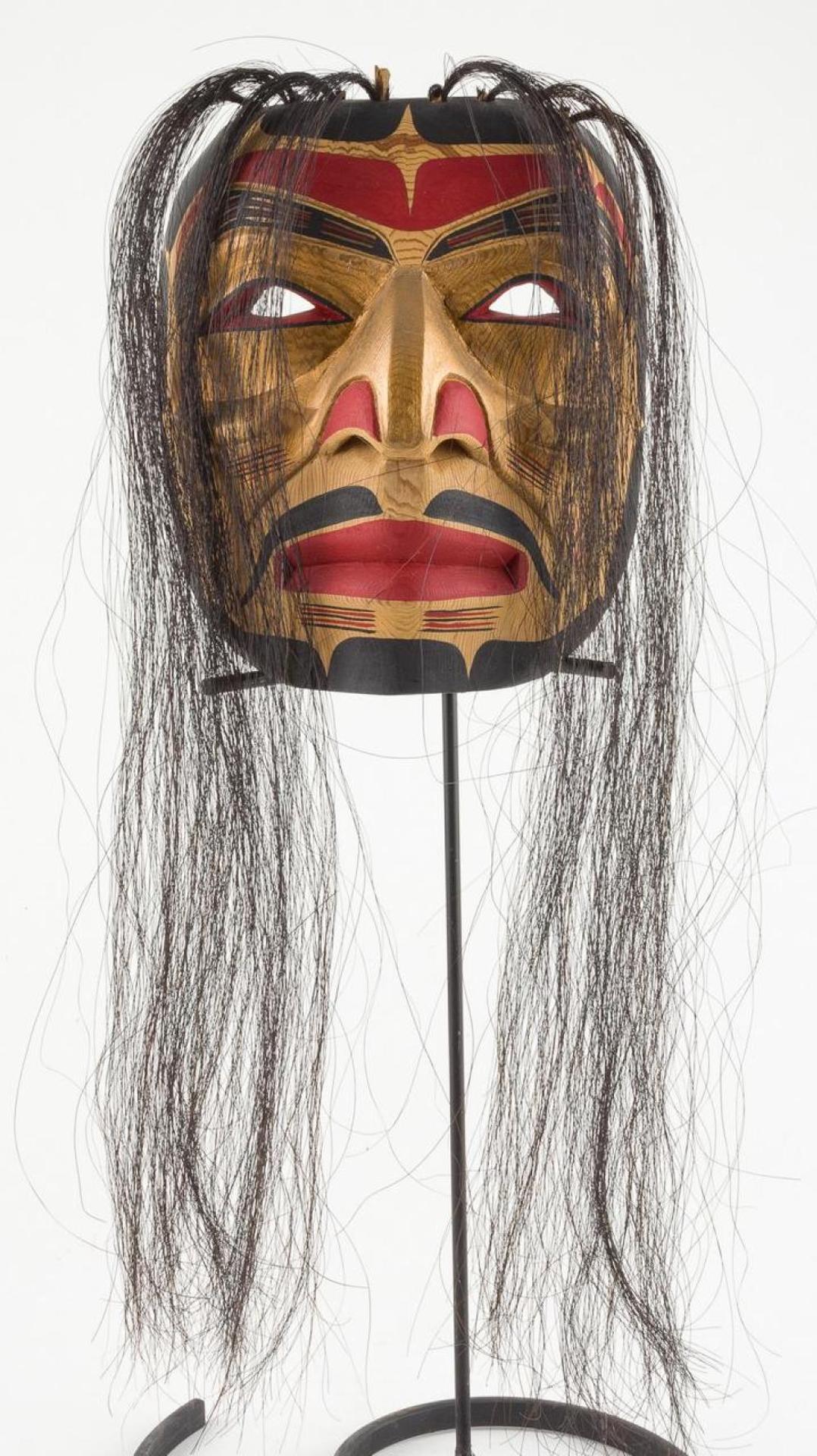 Emil Thibert - a carved cedar and polychromed portrait mask