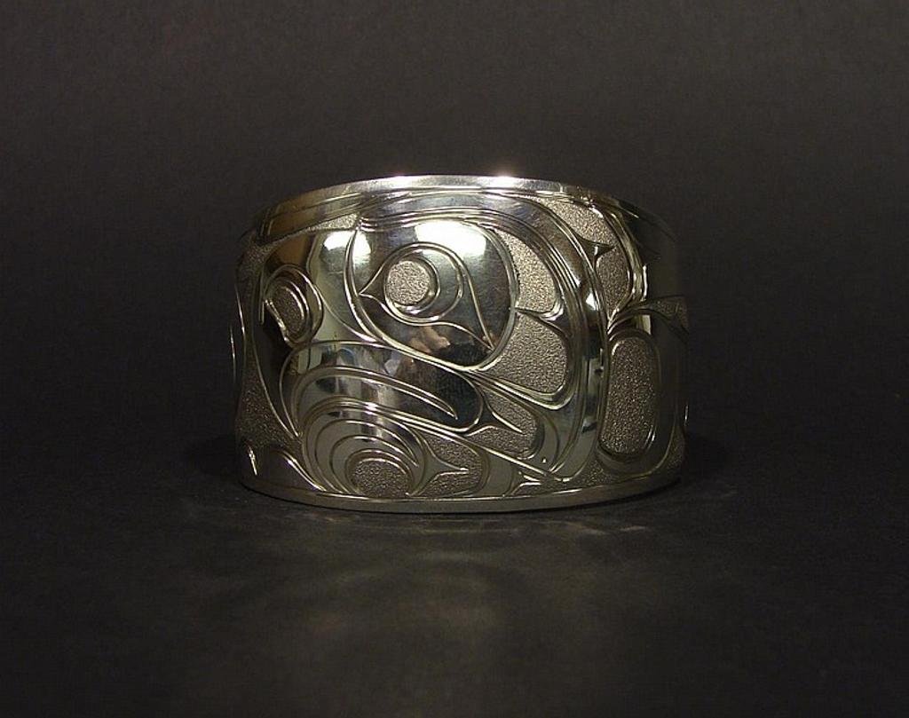 Joe Descoteaux - a silver Thunderbird design cuff bracelet