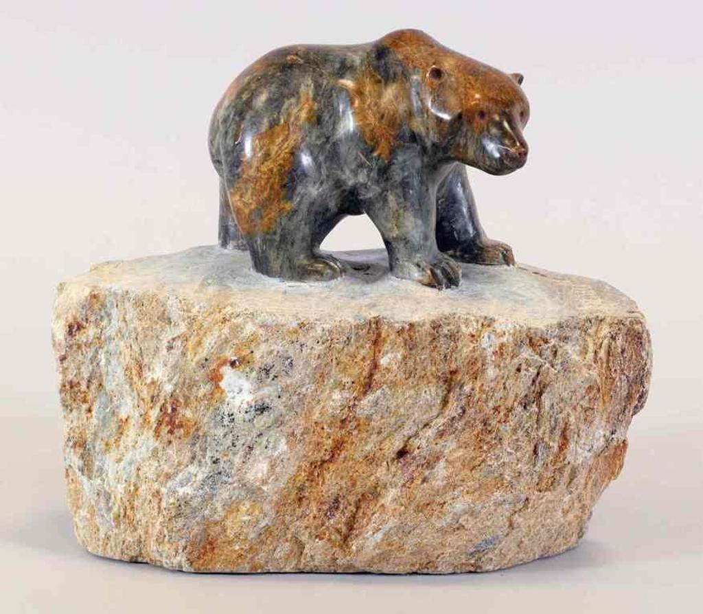Dorothy M. Willford (1933) - a mottled grey-orange stone carving of a Bear, monogrammed on the base
