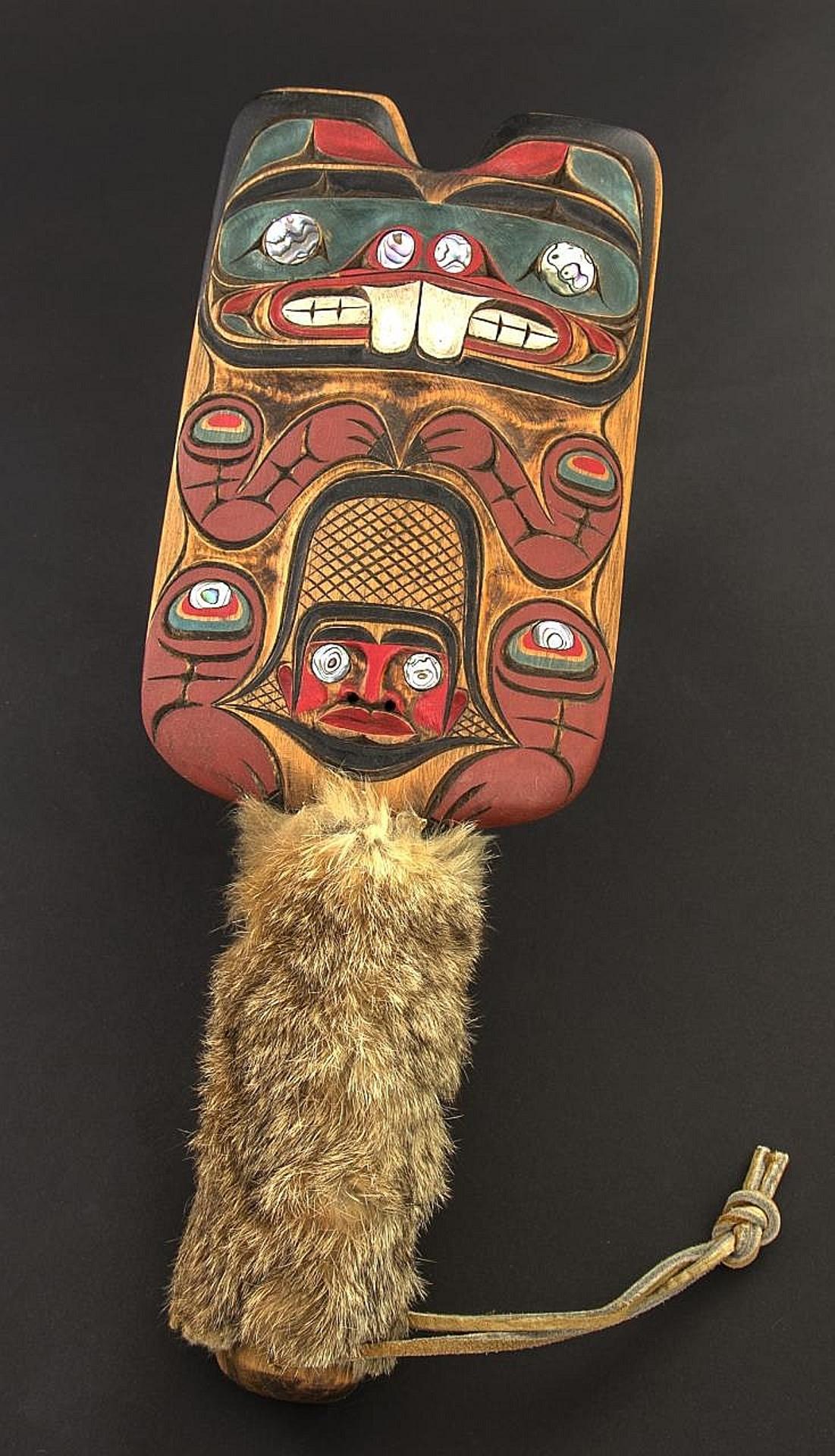 George V. James Sr. (1948) - a carved and polychromed Kwakiutl hand clapper in the Beaver design