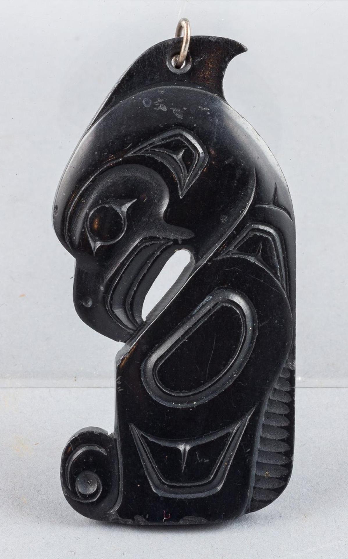 Denny Dixon (1944) - a carved argillite Haida Eagle pendant