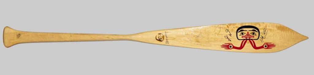 Roy Henry Vickers (1946) - a canoe paddle depicting a hand on one side and a man on the other side