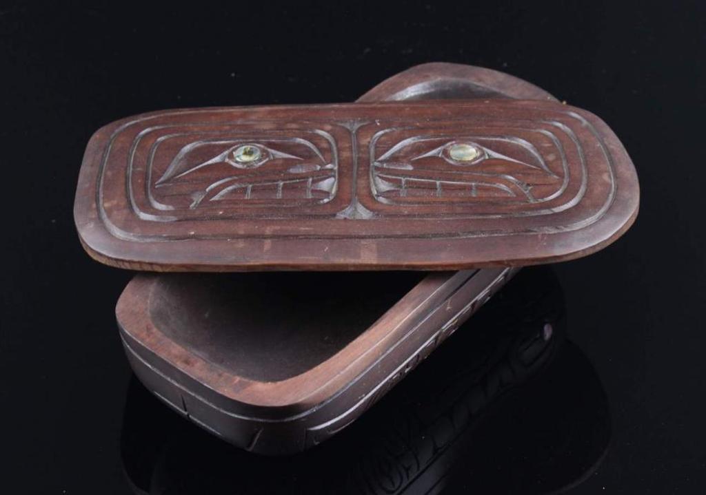 Carl Joseph - a carved and stained oval cedar lidded bowl