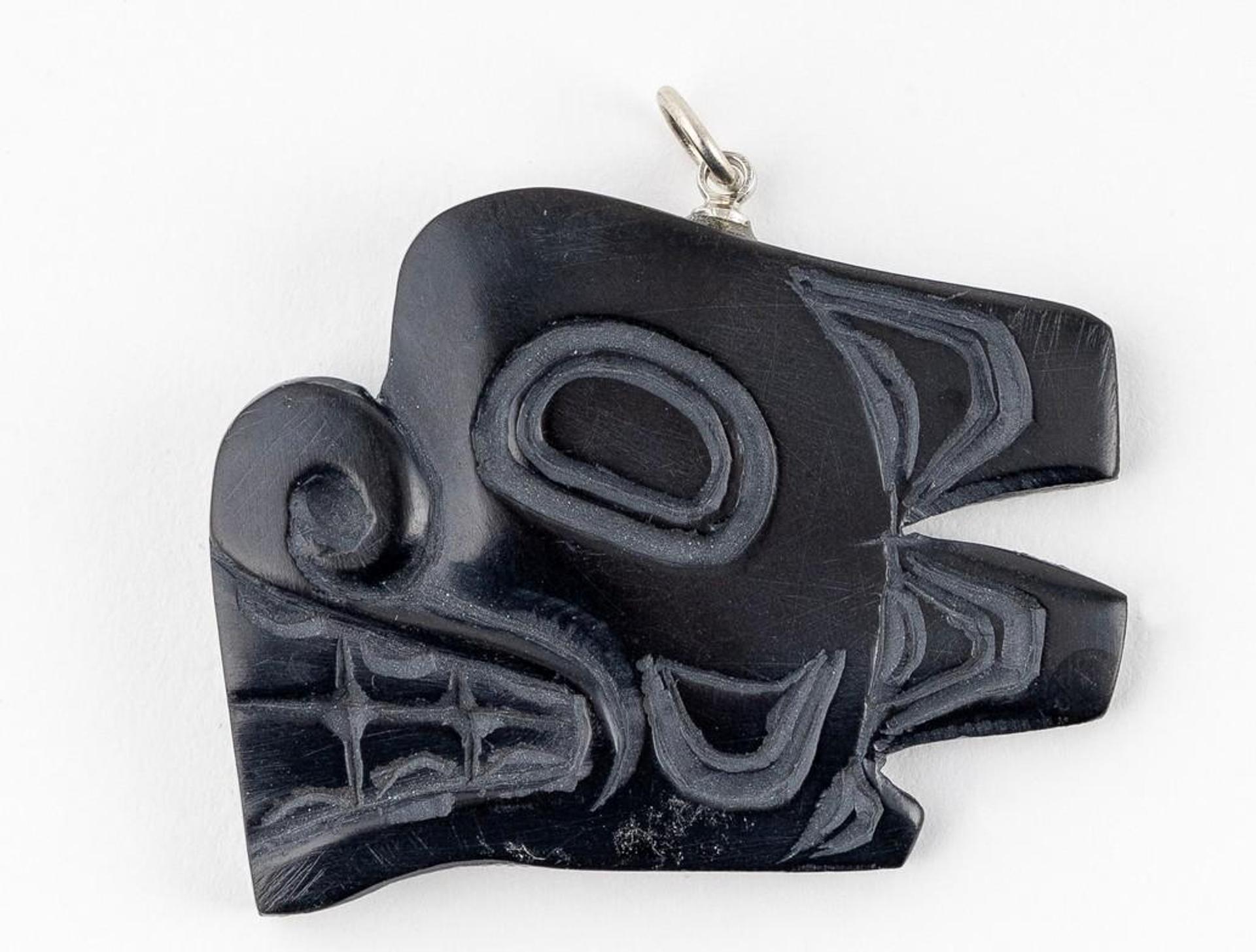 Greg White - a carved argillite pendant depicting Bear