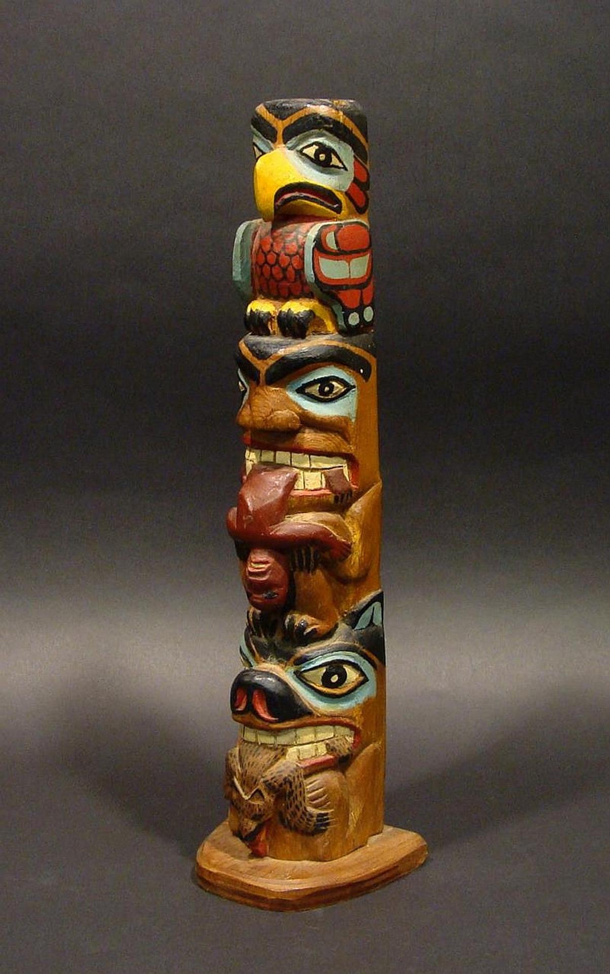 Titus Campbell - a carved and polychromed three figure pole