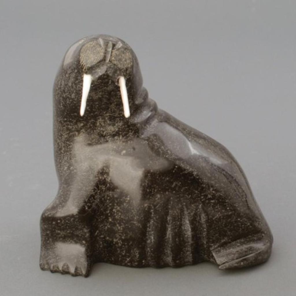 Adla Korgak (1928) - Black stone carving of a walrus