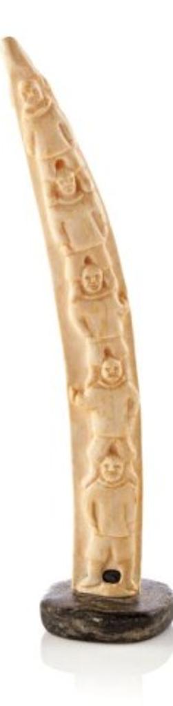 Charlie Panigoniak (1946) - Ivory Relief (Human Figures, Faces, Belu, Ca. 1964, Ivory on a stone base