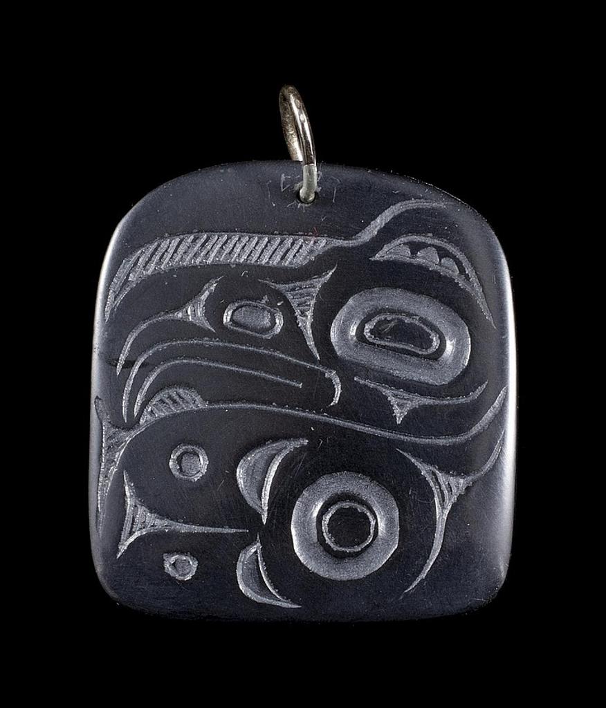 Pat Dixon (1938-2015) - a carved argillite pendant in the form of a Raven