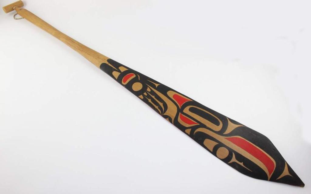 Wayne Bruce - a carved and polychromed cedar paddle.