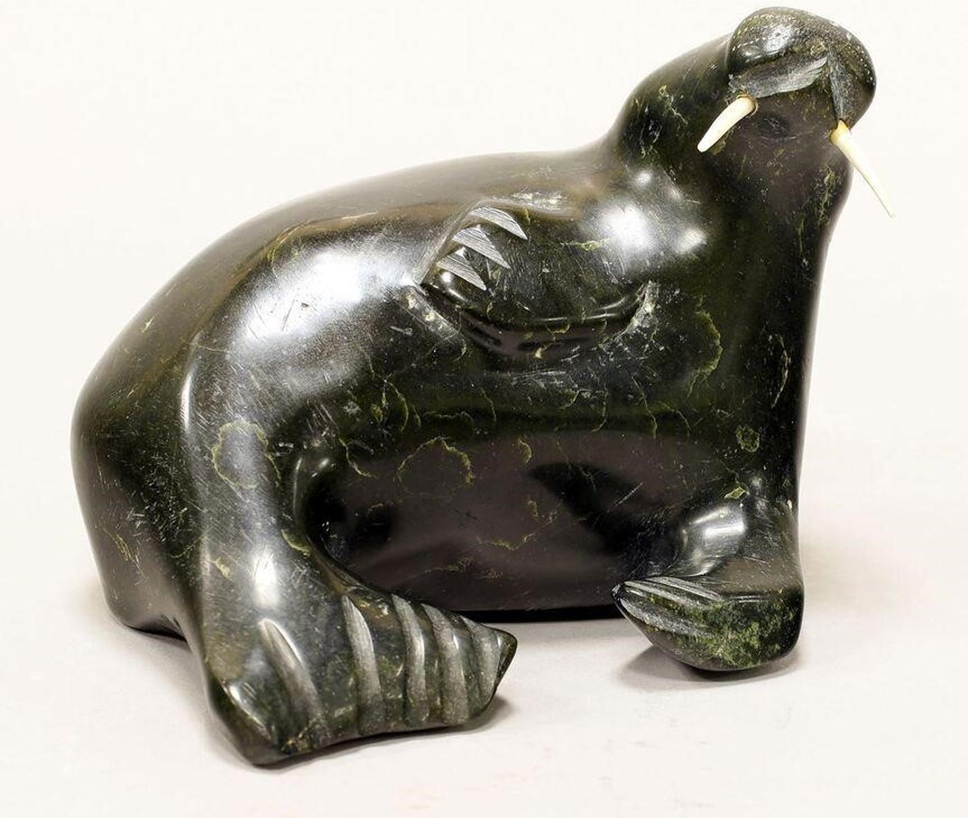 Jacob Kuluguqtuq (1924) - A dark green stone carving of a Walrus