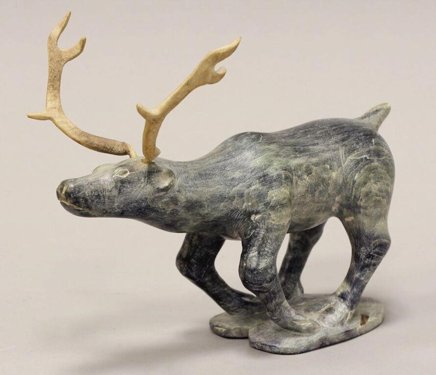 Bob Barnabas (1934) - Mottled grey stone and antler carving of a Caribou