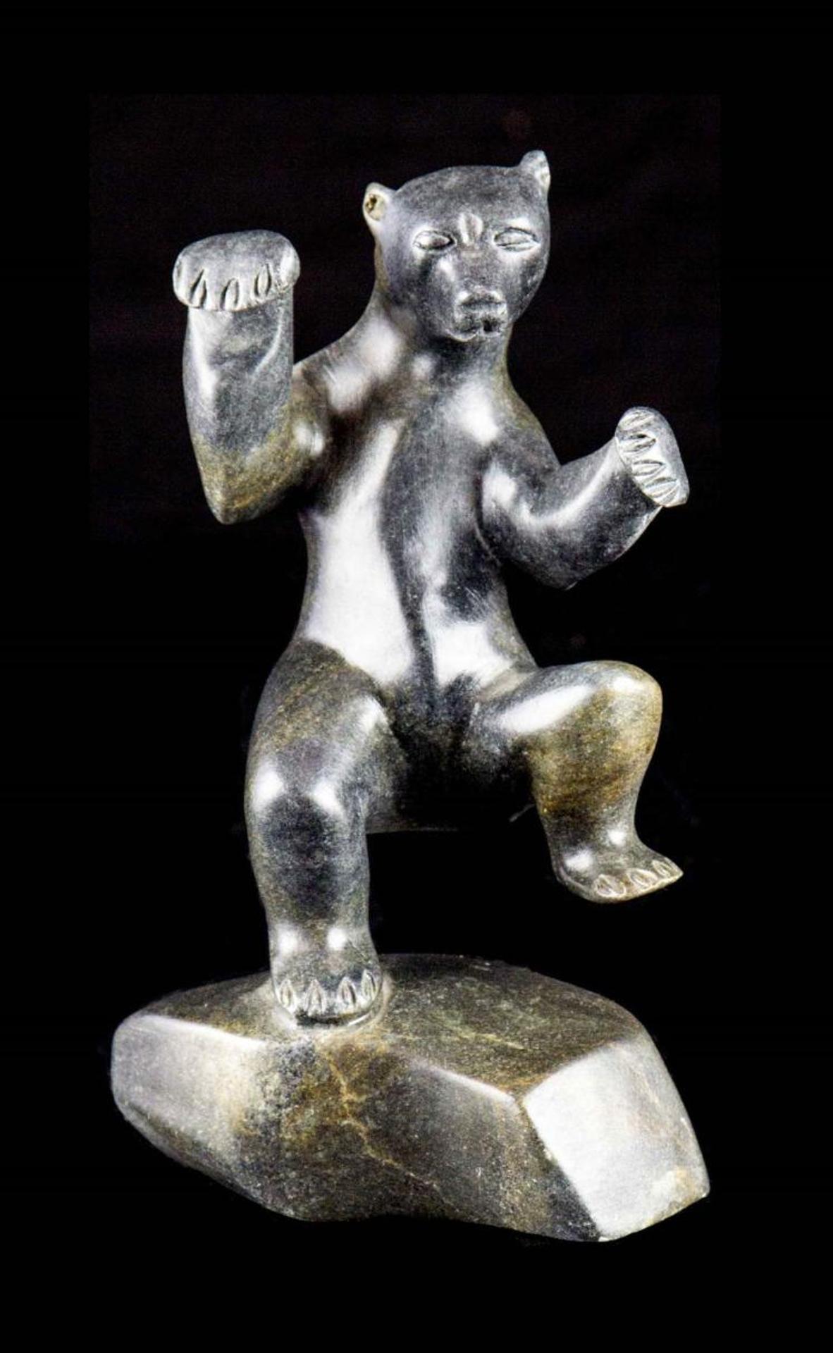 Eric [Amiraq] Lester (1966) - a grey stone carving of a dancing bear