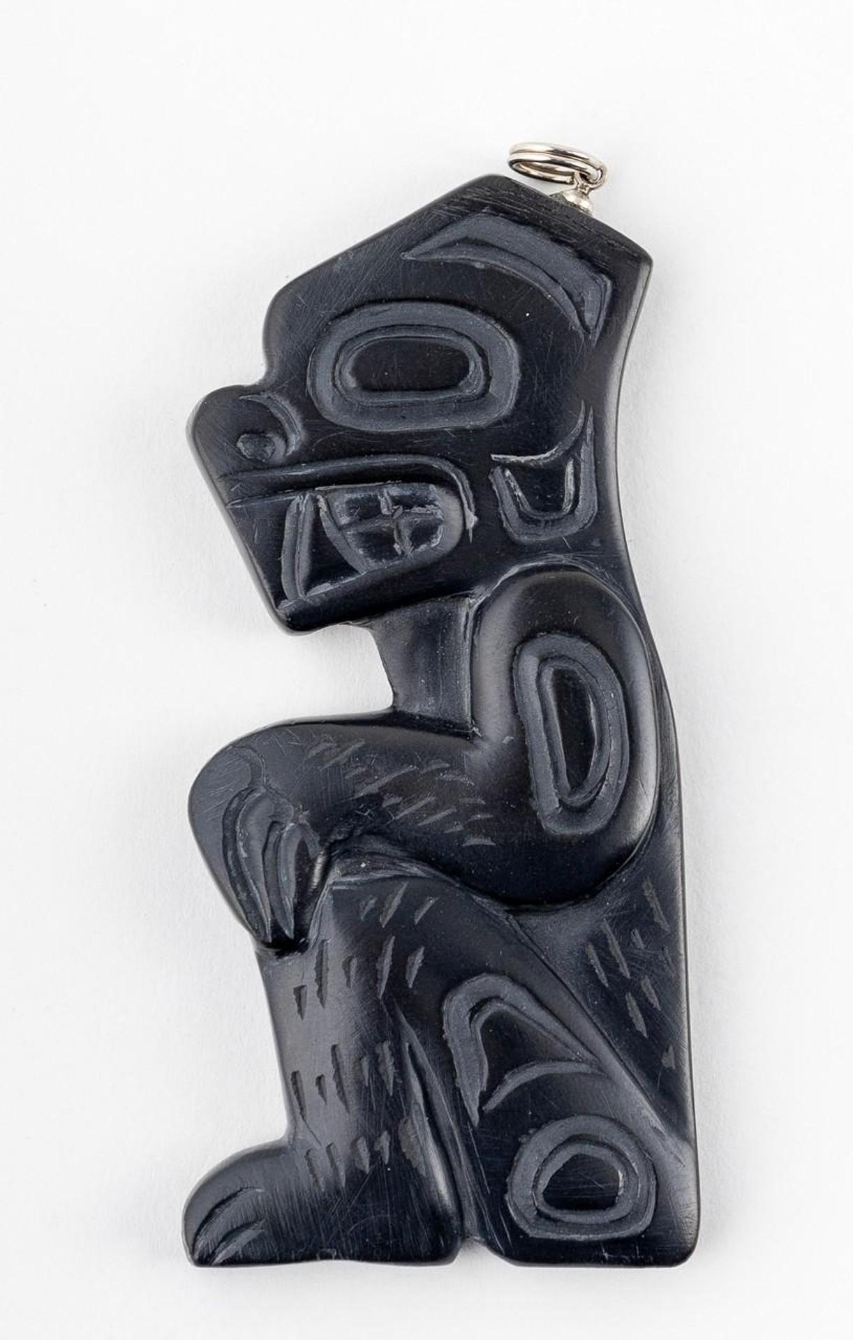 Gryn White - a carved argillite pendant in the form of Grizzly Bear
