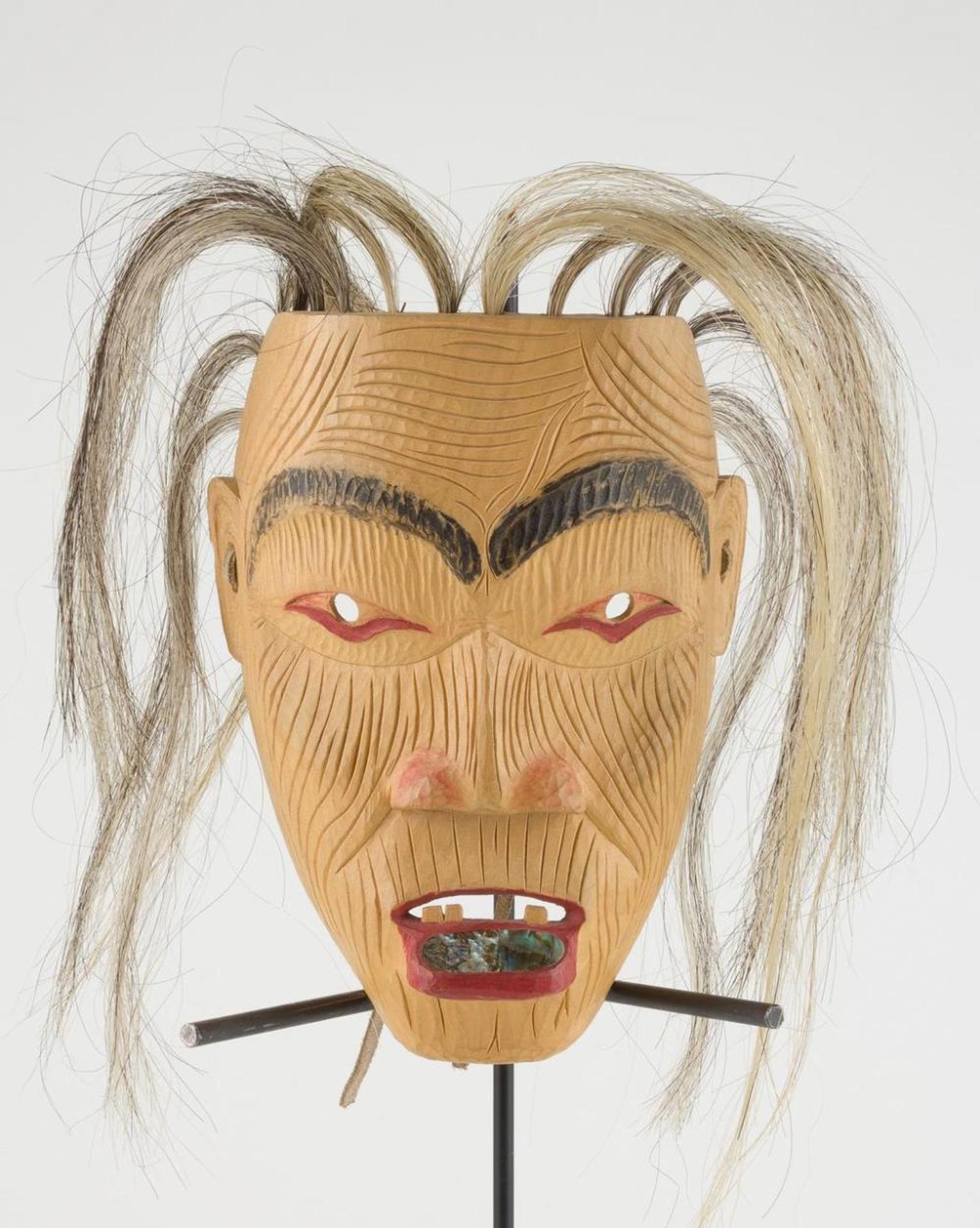 Gerry Dudoward (1950-1998) - a carved and polychromed Old Woman mask