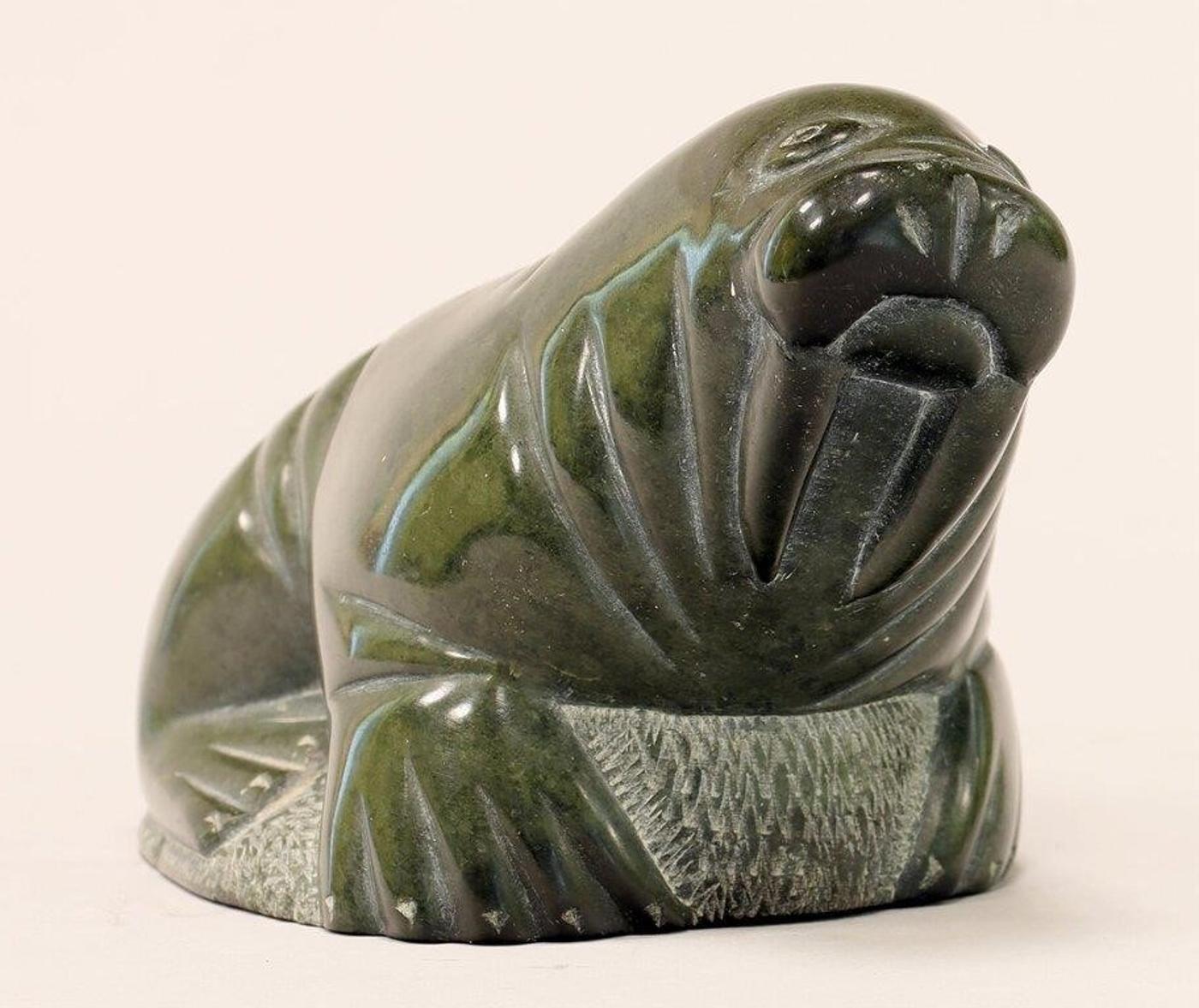 Isa Kasudluak (1917-1998) - A grey-green stone carving of a Walrus