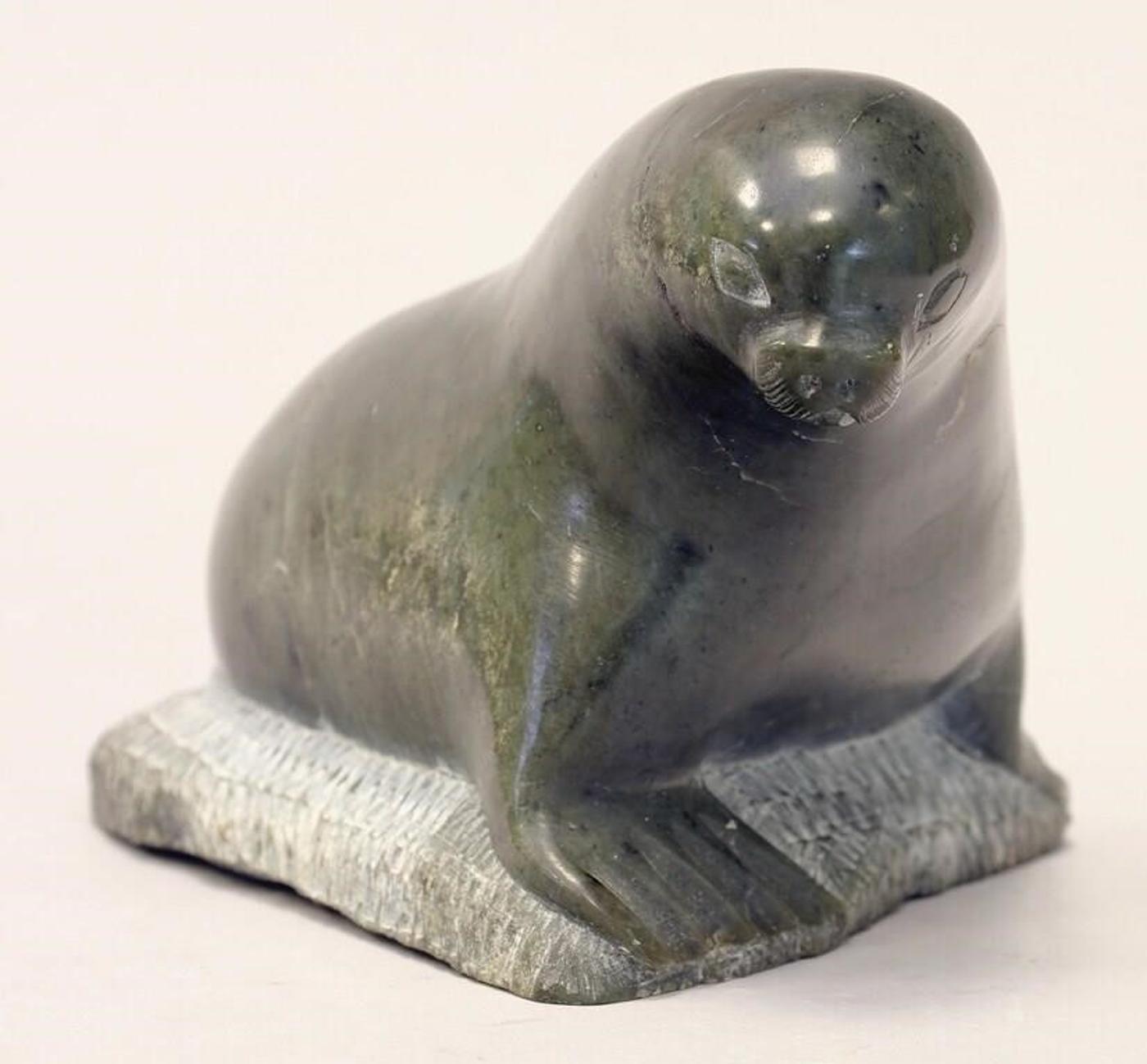 Noah Tukai (1925-1990) - A grey-green stone carving of a Seal