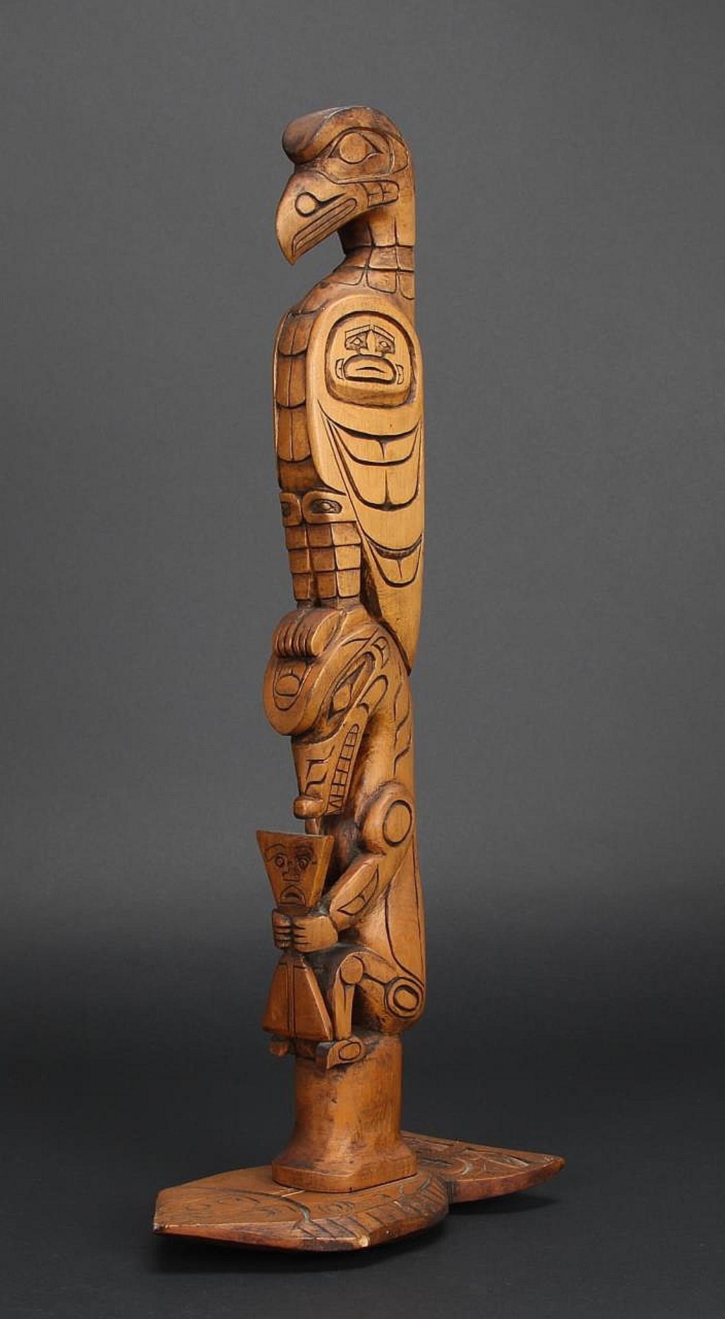 Charles Joseph (1959) - a carved and stained totem pole