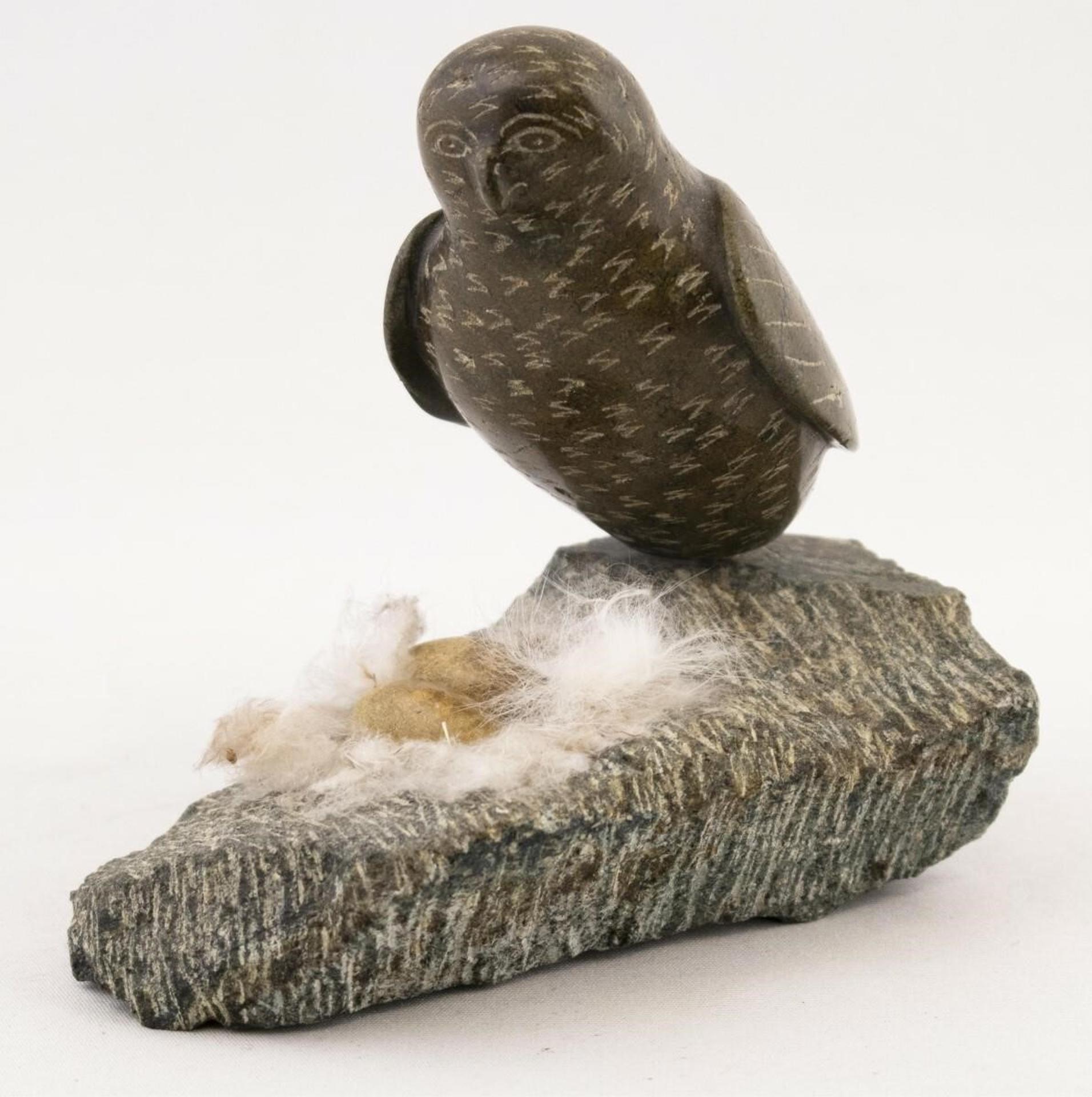 Kavavow King (1939) - a green and brown stone carving of an Owl Guarding Eggs in a Nest