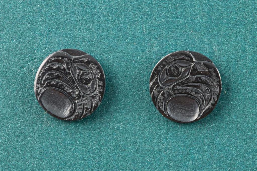 Donovan Gates - a pair of button type carved argillite earrings