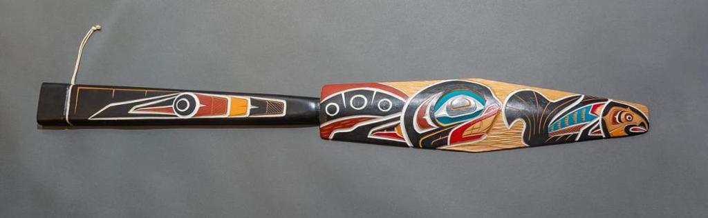 Bill Wilson (1944) - a carved and polychromed paddle depicting Salmon and Killer Whale