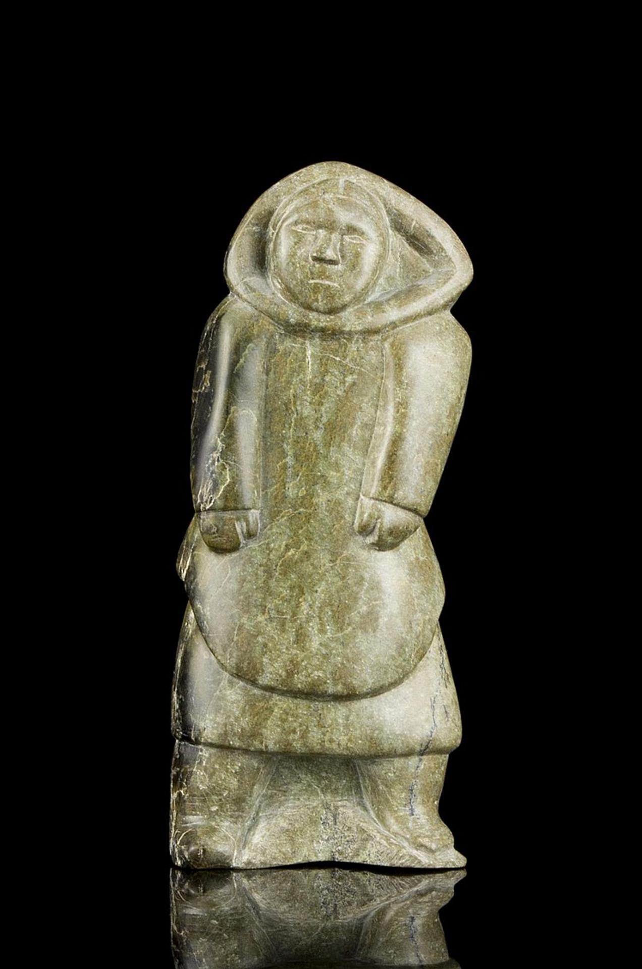 Napatchie - a serpentine carving of a standing Inuk