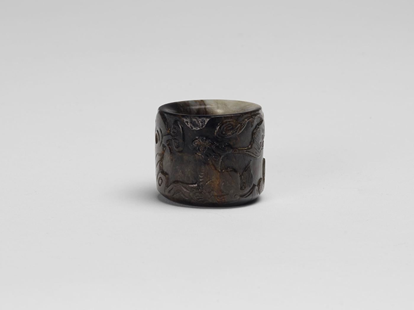 Chinese Art - A Chinese Mottled Jade Archer's Ring, 19th Century