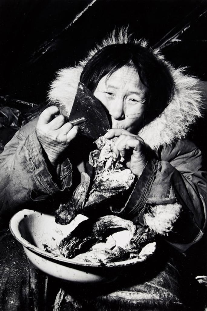 Richard Harrington (1911-2005) - Eskimo Woman Eating Caribou Meat