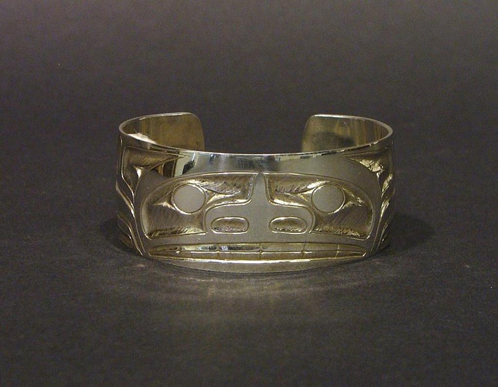 John Alexander - a carved silver cuff bracelet with Bear design