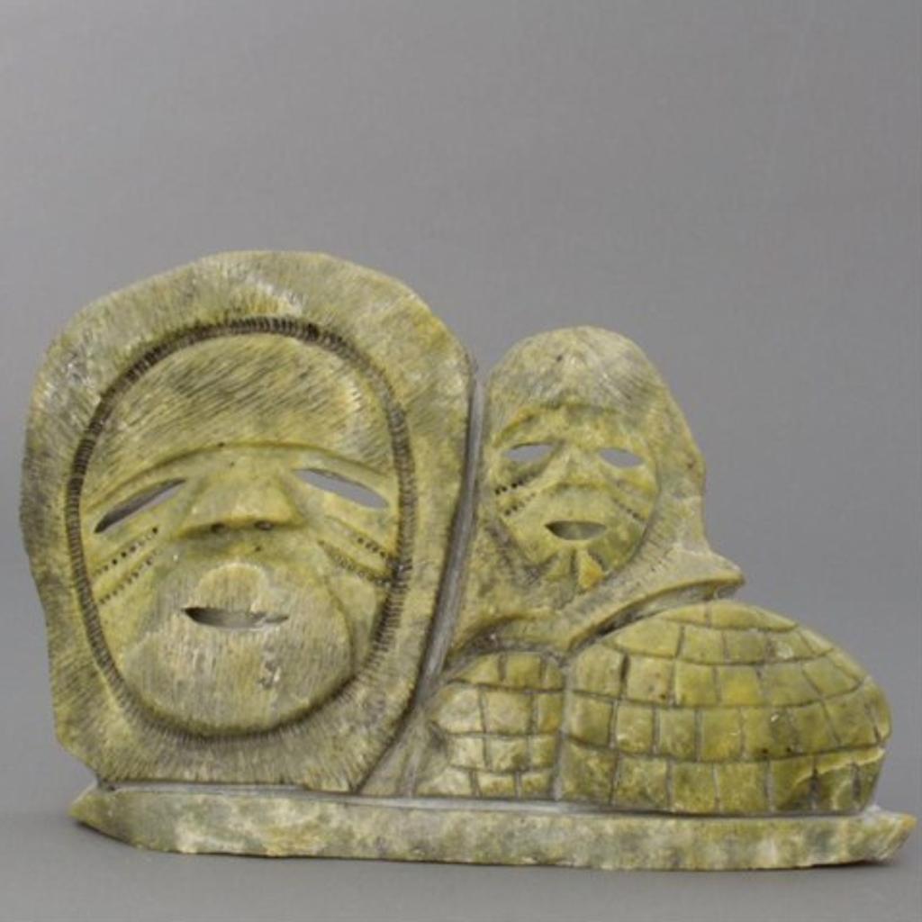 Willie Ishulutak (1979) - Emerald green stone carving of inuit faces and igloos