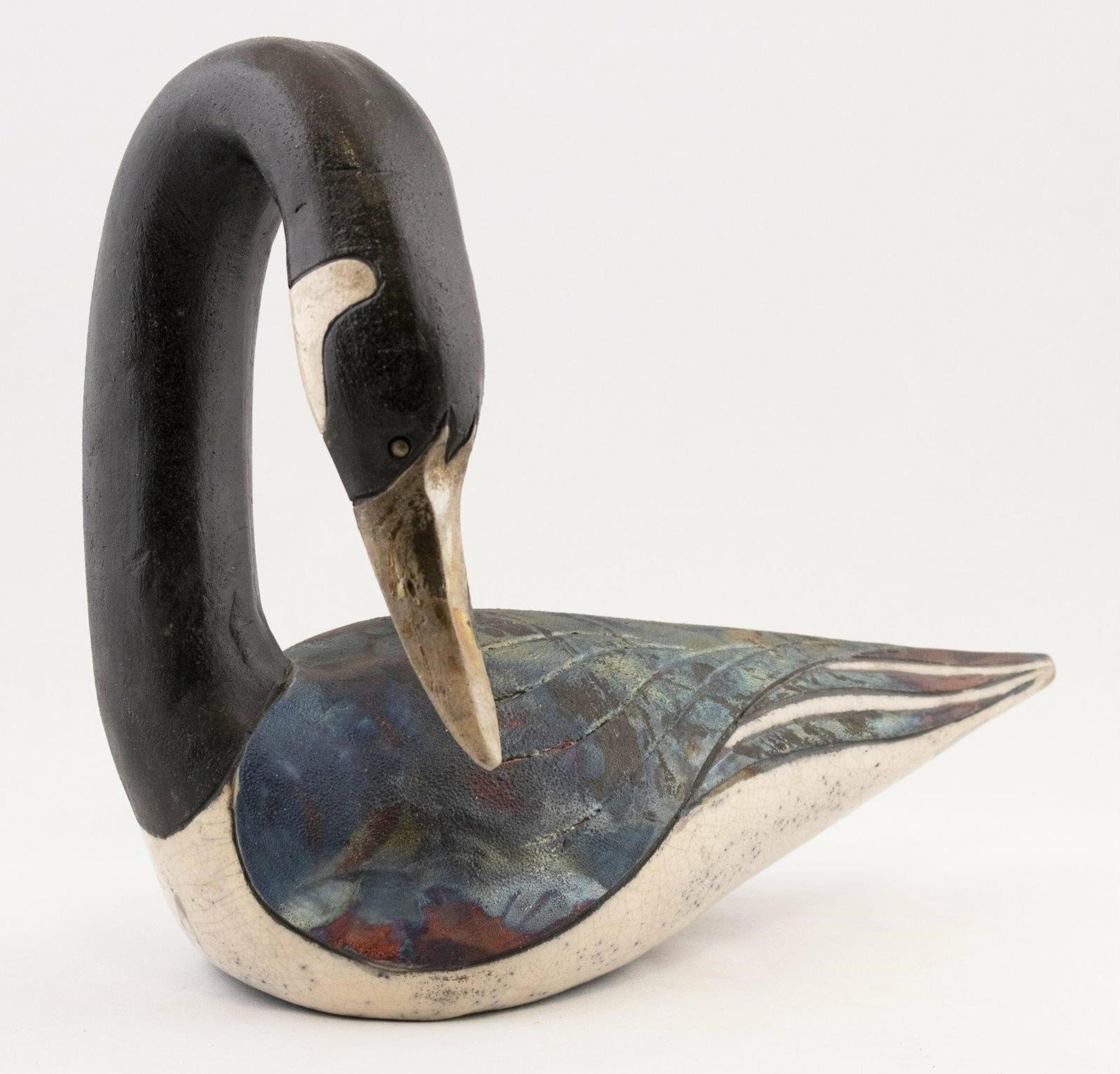 Lorel Sternig - a ceramic sculpture of a Goose with multi-coloured Raku glaze