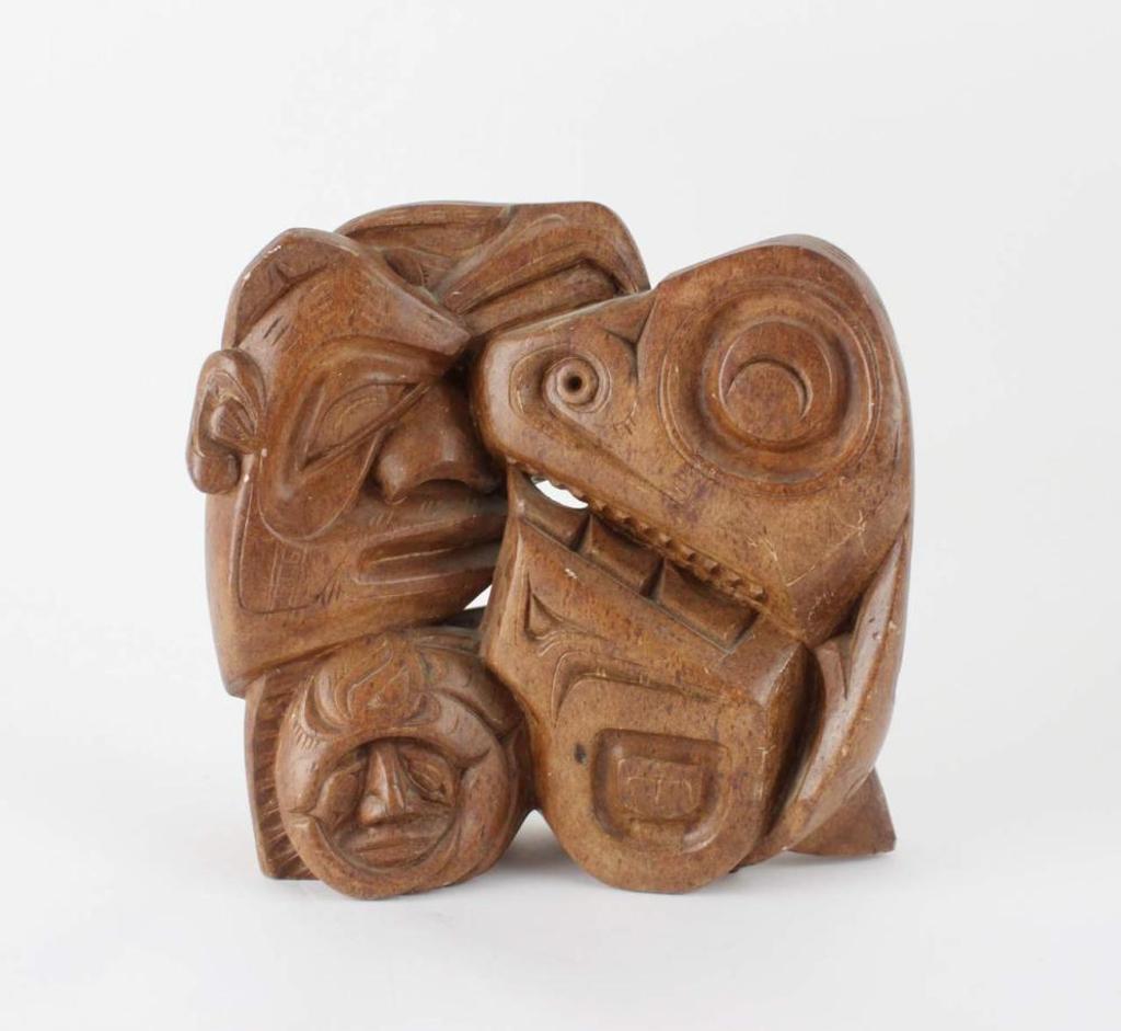 Tom Duquette (1940) - a brown Brazilian stone carving depicting various Northwest Coast figures entwined