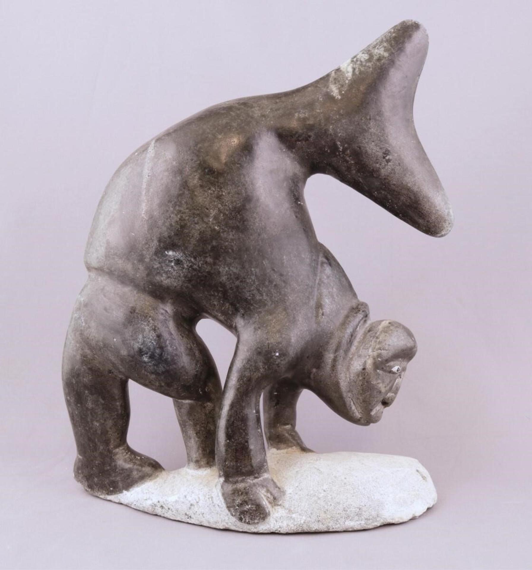 Lizzie Leah Kudluk (1936) - a black-grey stone carving of a Fish-Man Transformation; 1979