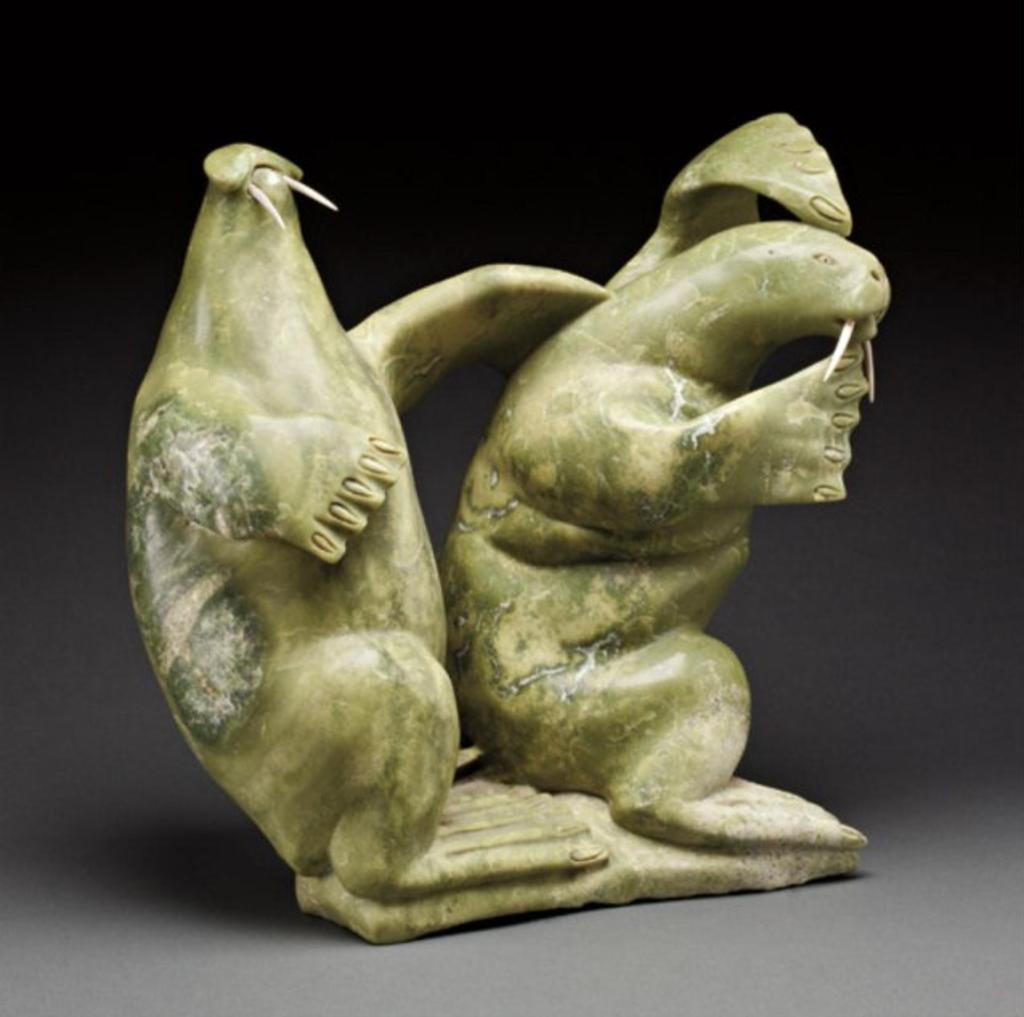 Kiugak (Kiawak) Ashoona (1933-2014) - Mottled light green stone and ivory