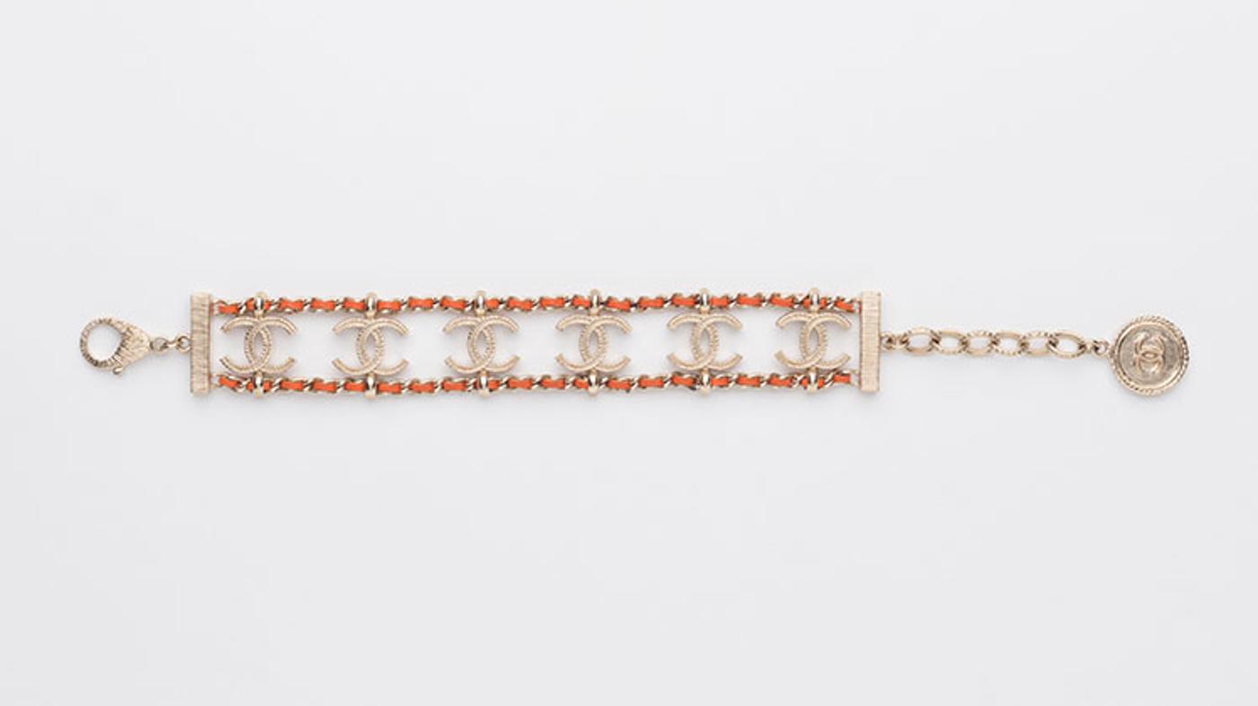 Chanel - A WOVEN BROWN LEATHER AND METAL CHAIN BRACELET