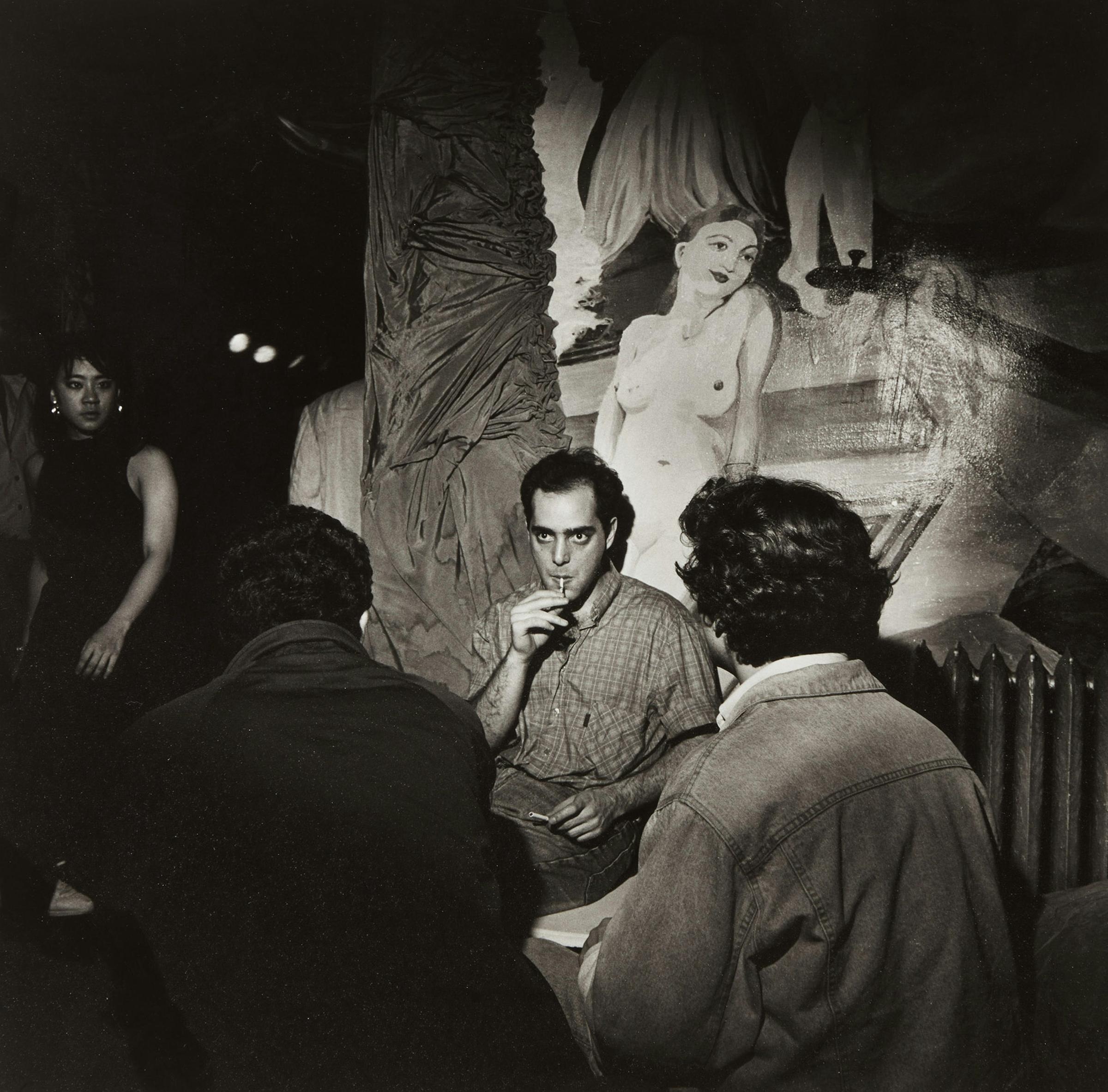 Larry Fink (1941-2023) - Man with Reefer, Nude on Wall, NYC