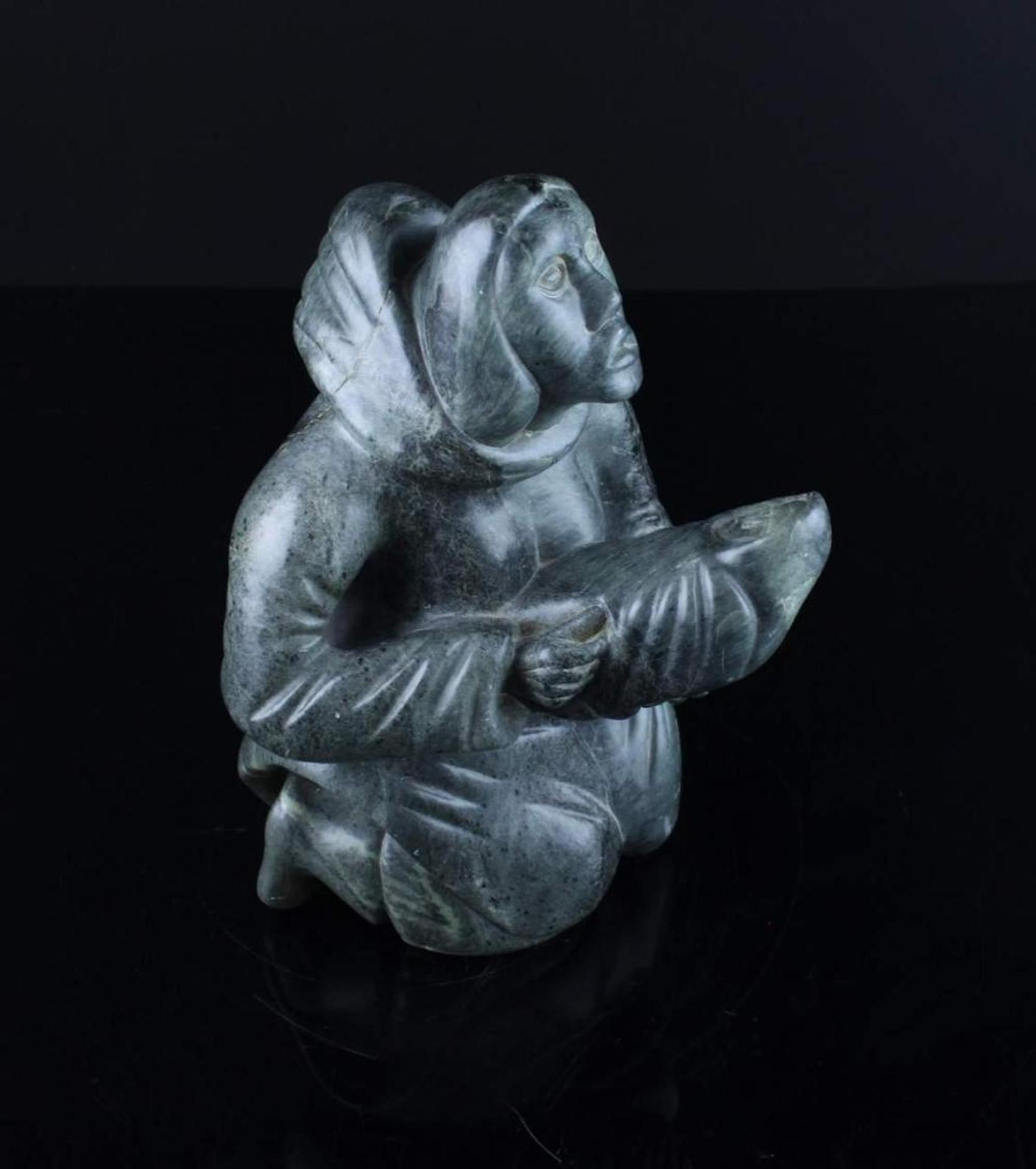 Floyd Grossetete - a green stone carving of a Mother and Child