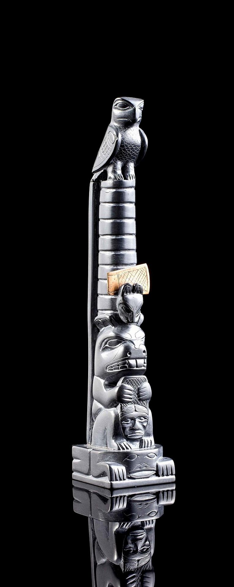 Tom Hans (1925) - a carved argillite pole in the form of a house post