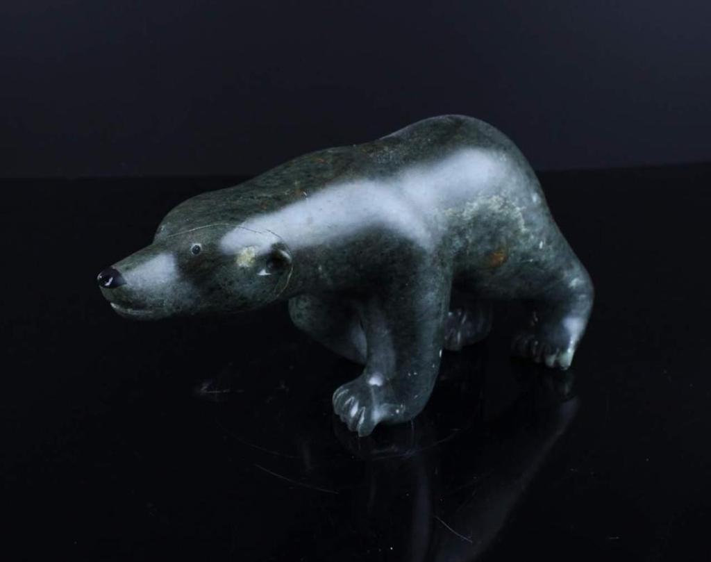 J. Kalinek - a green stone carving of a polar bear