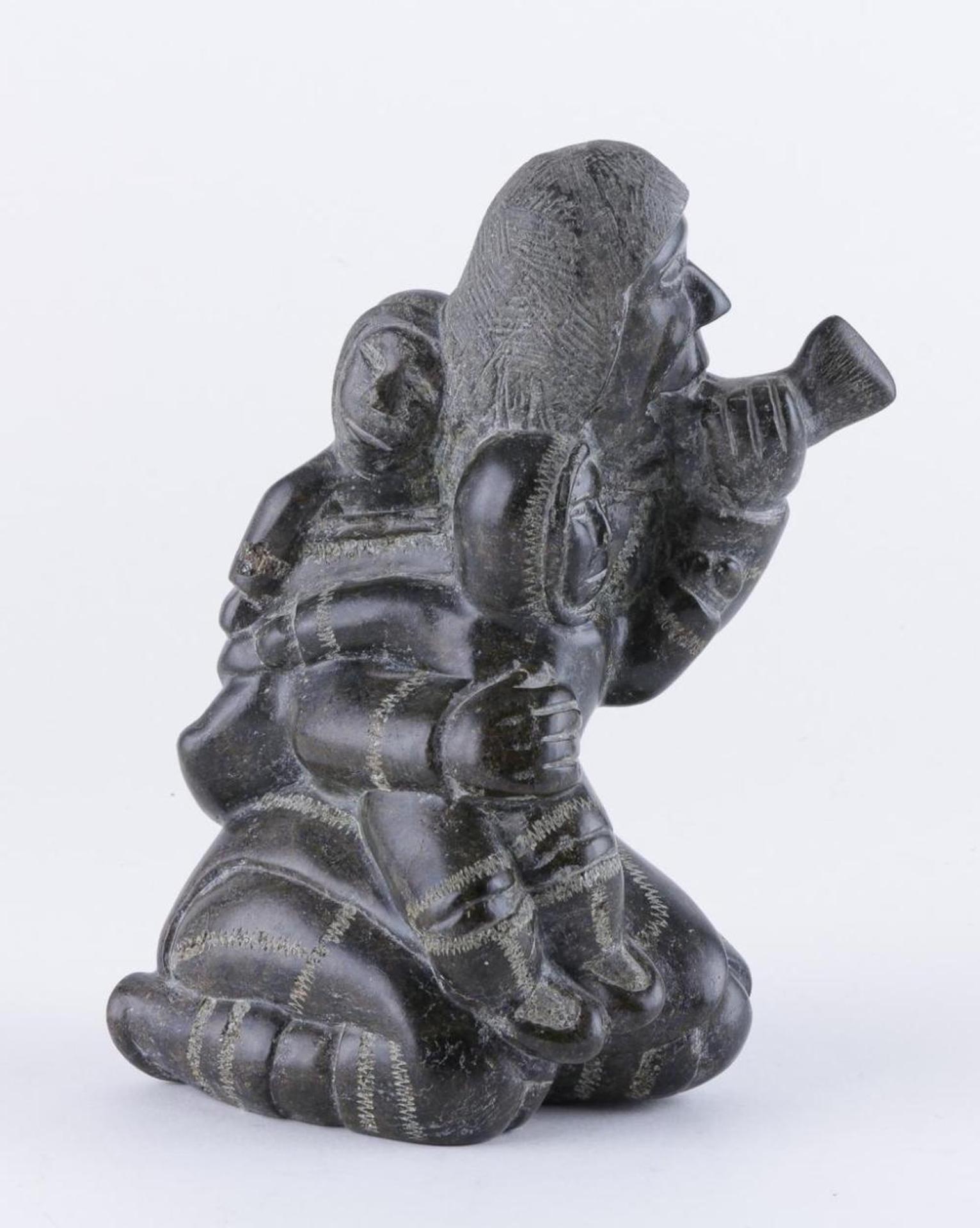 Koviala Tookoonuk Kimmirut - a black stone carving of a mother and children