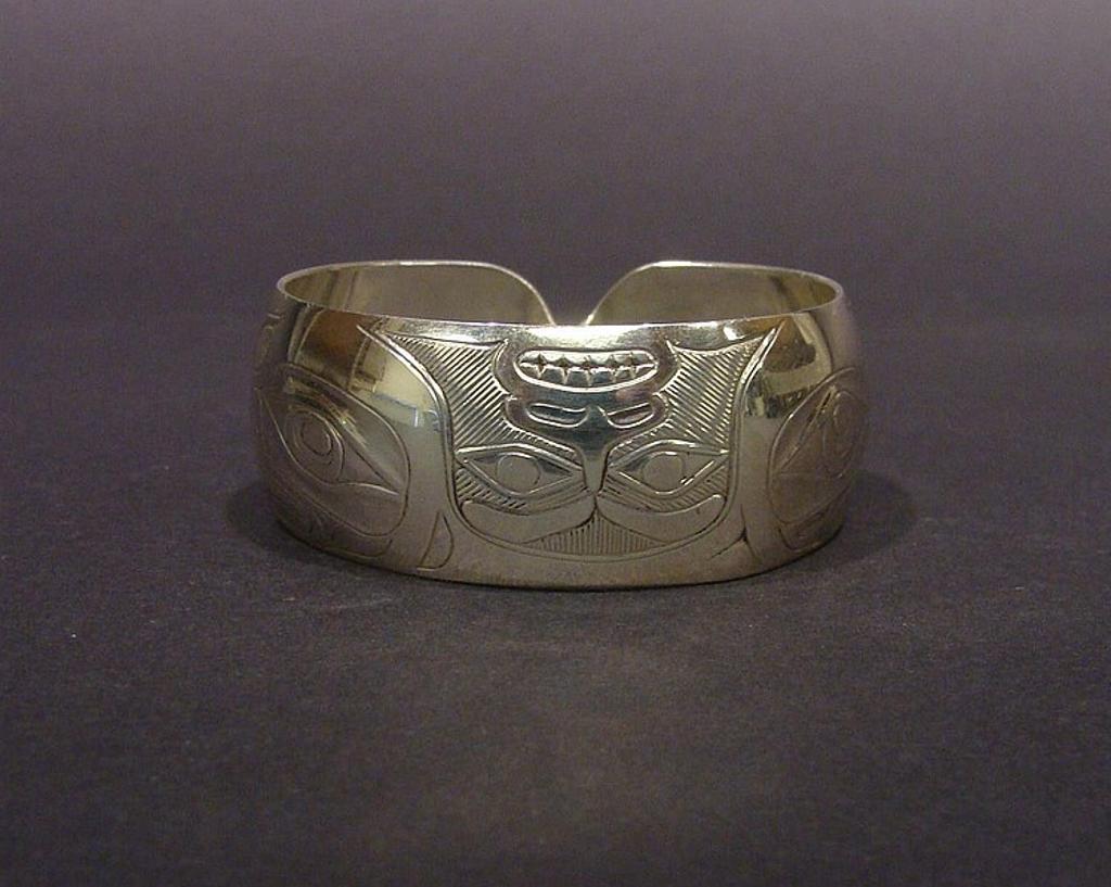 Derek Wilson (1950-2011) - a silver cuff bracelet with Raven design width