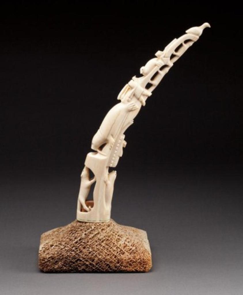 Victor Sammurtok (1903-1980) - Chesterfield Inlet, Walrus tusk on a base, carved with animals, hunter and sled, ca. 1967, ivory