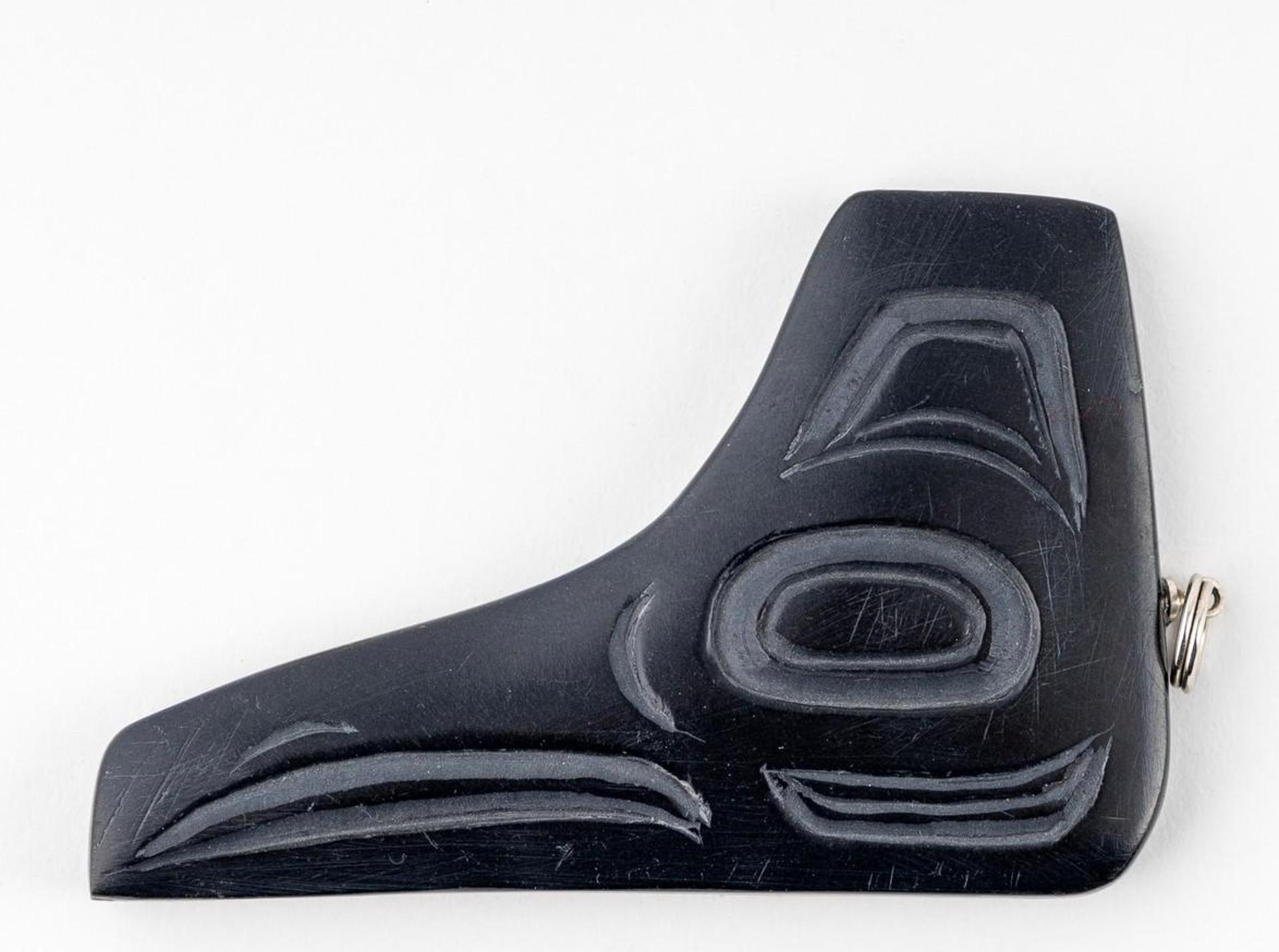 Gryn White - a carved argillite pendant in the form of Raven
